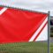 4x8 13oz vinyl banner with grommets on a chain link fence