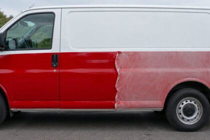 Wrapped van with the red wrap fresh on one half and faded and lifting on the other